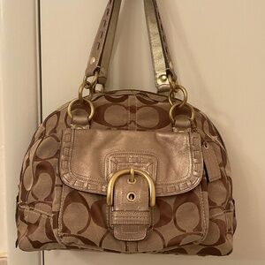 Coach monogram bag with gold details in leathers.